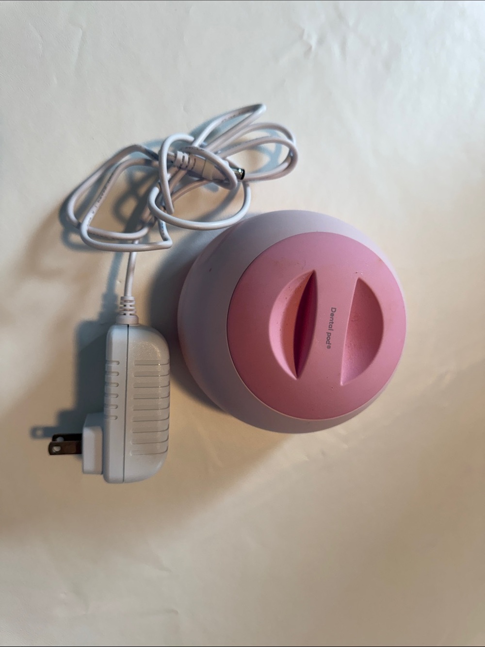 Pink Round Electric Device with Charger